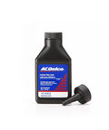 Street Tested Pro Grade Limited Slip Differential Additive Slick Smooth Rear End Lube Cuts Friction And Axle Whine Heavy Duty American Built Gear Guard Four Ounce in a black bottle with a nozzle.