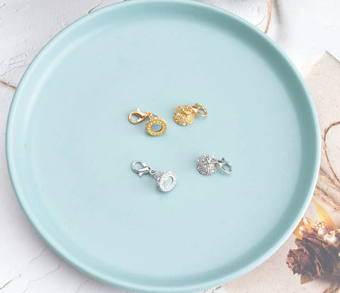 Two Pack Magnetic Locking Clasps With Rhinestone Lobster Clasps for jewelry making, shown on a blue plate, gold and silver options visible.