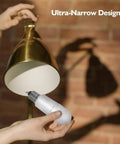 Inserting Enclosed Fixture LED Stick Bulbs 14W, 100W Equivalent into a lamp, showcasing ETL Certified energy-saving design.