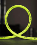 ZillaGreen Air Hose Three Eighth Inch By Fifty Feet With Quarter Inch MNPT Fittings, shown coiled on a dark surface