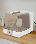 Portable Countertop Dishwasher With Built In Water Tank No Hassle Automatic Cleaner With 360 Rotating Spray Arm Three Wash Cycles fits plates on a kitchen countertop.
