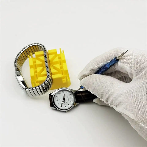 Hand using 147Pcs Watch Repair Tool Kit With Portable Case For Band Link Removal And Watch Maintenance Professional Grade Precision Screwdrivers