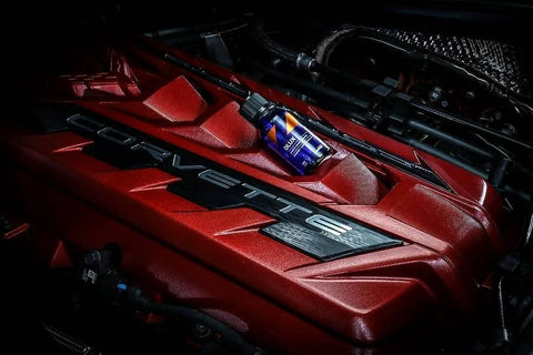 CarPro CQUARTZ DLUX 30mL bottle on red Corvette engine cover