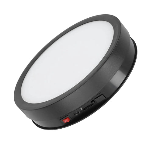 Huge 360 Degree Electric Rotating Turntable Stand With Remote Control And Adjustable Speed Plus Colorful LED Lighting For Pro Product Photography Videos And Live Streams Using USB Power with LED light and control buttons.