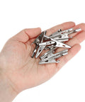 Hand holding 50 Pcs Stainless Steel Alligator Clips Test Leads Crocodile Clips With Screw Probes, Two Inch Length, High Conductivity