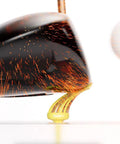 Golf club striking ball from unbreakable yellow plastic tee, sparking effect, showcasing 3 1/8 inch durable design.