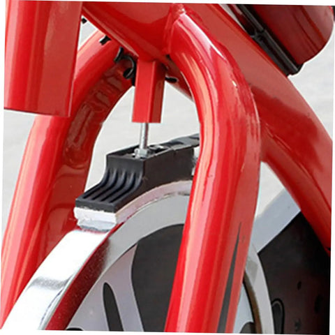 Close-up of installed Four Piece Fitness Bike Brake Pad Set for Exercise Bike Replacement Braking Pads, red frame visible