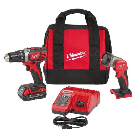 Industrial Strength M18 Cordless 1/2 Inch Hammer Drill With Led Work Light Brushless Motor Power For Killer Wood And Masonry Jobs A Top Shelf Build Designed To Outlast in a red carrying bag with charger and flashlight.