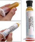 Pro Grade Solder Paste Flux Grease RMA223 10cc tube held in hand for precise rework and repairs