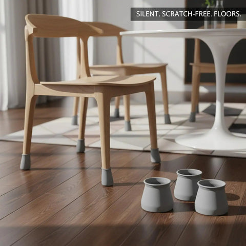 Gray PU Leather Furniture Leg Protectors 8 Pack Scratch Resistant Floor Guards For Hardwood And Tile Silent Glide Chair Table Foot Caps on wooden floor under chairs.