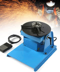 Heavy Duty Welding Positioner With Manual Chuck And Adjustable 0 To 90 Degree Turntable Featuring Stepless Speed Control 20W Motor on blue metal workbench.