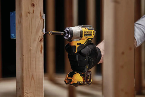 Compact 12V Max Cordless Impact Driver Kit Featuring A Brushless Build And Quarter Inch Quick Swap Chuck for drilling into wood.