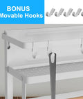 Close-up of Magnetic Foldable Paper Towel Holder With Shelf and 5 Removable Hooks, attached to metal surface.