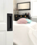 Knuckle Friendly Matte Black Recessed Pocket Door Handles Offer Zero Snag Edges And Dead Simple Screw Mounting Includes Four Finger Flush Pulls For A Clean Invisible Cabinet Or Closet Hardware Setup on a white door