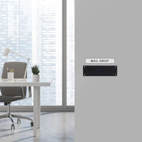 Through The Wall Mail Drop Chute Adjustable Two Piece Steel Deposit Slot installed in office space, black finish, wall view.