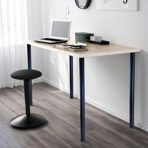 Minimalist desk with heavy duty 32 inch metal desk legs set of 4 with 1 inch leveling feet and mounting plates, in a modern office setting.