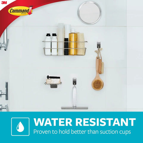 Wall And Cabinet Organizer With Water Resistant Strips for Clutter Free Bathroom on tiled wall holding toiletries and brush.