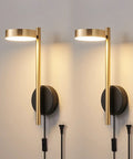 Two In One Plug In Or Hardwired Industrial Gold Brass Wall Sconces with Adjustable Metal Arm Dual Pack for Bedrooms Hallways Entryway Kitchen and Living Areas, shown lit on a wall.