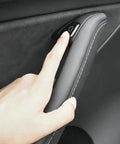 Clean 11 Piece Interior Window Switch Covers And Door Control Button Trim Kit For Tesla Model 3 And Model Y 2017 To 2023 shown with finger pressing button.