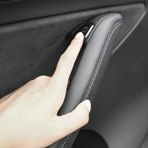 Clean 11 Piece Interior Window Switch Covers And Door Control Button Trim Kit For Tesla Model 3 And Model Y 2017 To 2023 shown with finger pressing button.
