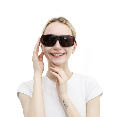 Top Shelf Laser Tattoo Removal Safety Glasses With Od5 Brown Lenses on smiling woman, showcasing sleek design and fit for artists.