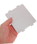 Person holding a Microwave Oven Mica Sheets 10 Pieces Heat Resistant Mica Flakes Replacement Kit Universal Fit Insulation Plate