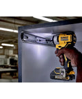 Person using Atomic 20V Max Impact Driver Kit With 1700 In-Lbs Torque in tight cabinet space