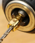 Close-up of the 10pcs Mini Drill Chuck Adapter for Copper Rotary Tool Collet 0.5-3.2mm in use with a drill bit.