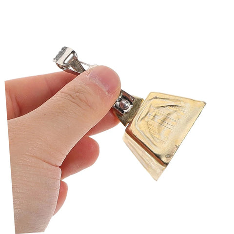 Hand holding stainless steel fishing bite alarms for rods