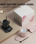 Level Up Your Morning Vibe This Smart Mug Warmer Game Changer Keeps Your Daily Brew Piping Hot With Precision Temp Control 15 Oz Ceramic Mugs Lids And Spoons Simple Cord Setup, includes black ceramic mug, pink cup, warmer base, spoon.