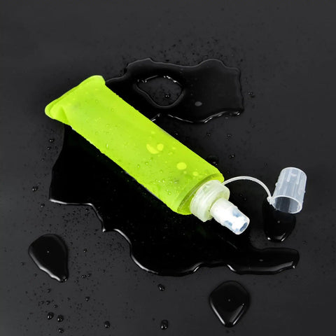 Leak Proof Folding Water Bottle With Sport Design, collapsible, green soft bottle, on wet surface, ideal for gym, hiking, camping