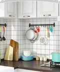 Heavy Duty S Shaped Hooks Matte Black 20 Pack for Hanging Pots and Pans in a Kitchen, shown on wall rail with utensils
