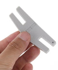 Close-up of Two Pack Hump Jumper Sewing Tools Denim Foot For Quick Button Clearance And Thick Hemming Plastic Hemmer Foot Set