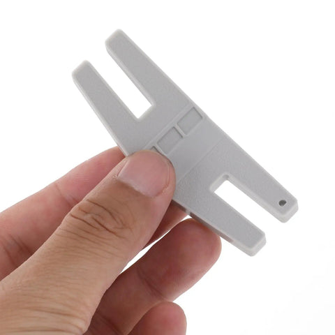 Close-up of Two Pack Hump Jumper Sewing Tools Denim Foot For Quick Button Clearance And Thick Hemming Plastic Hemmer Foot Set