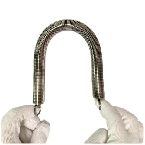 Beatdown Ready 304 Stainless Steel Pull Spring With Double Loop Hooks And Knockout Tension For Tough Diy Jobs And Garage Shop Tweaks At 25 Mm Outer Diameter held in hands.