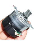 Hand holding 12-24V Brushless Servo Motor With Built-In Drive And Encoder, PWM Speed Control visible, compact and durable design