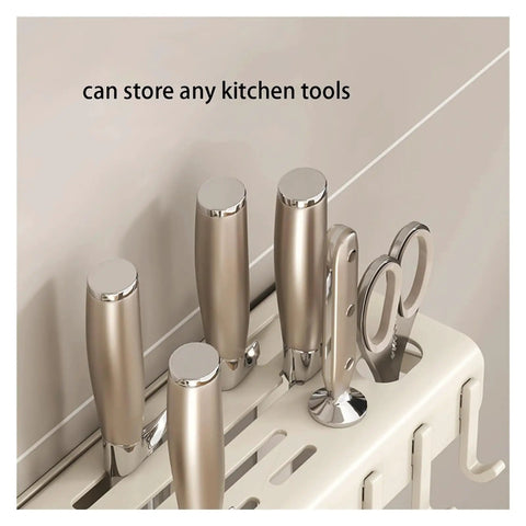 Rock Solid Wall Mounted Storage Rack With No Drill Setup Heavy Duty Carbon Steel Heat Resistant Kitchen Shelf holding kitchen tools.