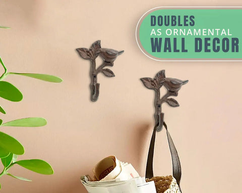 Heavy Duty Cast Iron Bird On a Branch Wall Hook With Screws Included For Real Deal Rustic Home Decor And Darn Smooth Hanging Organization You Will Love mounted on a wall with bags.