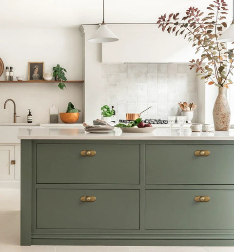Kitchen with Antique Brass Cabinet Knob With Backplate Set on green drawers, 24mm zinc alloy, vintage brushed finish, six pack installation.