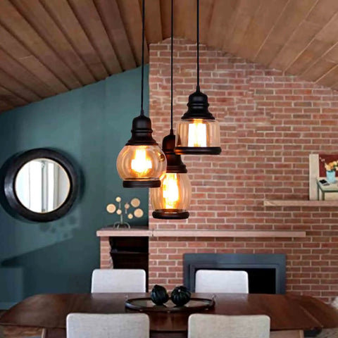 Vintage Farmhouse Pendant Lights Dope For Kitchen Island With 3 E26 Sockets Black Metal Glass Jar Chandelier Ceiling Fixture Adjustable Height To 43 Inches Rustic Dining Room Lighting, hanging in a rustic dining room with exposed brick wall.