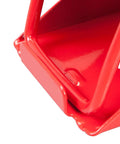 Close-up of a foldable red steel wheel chock corner, part of the Beefy Foldable Steel Wheel Chocks Pair, Heavy Duty Red Tire Stops.