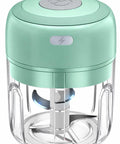 Compact Electric Mini Vegetable Chopper, USB Rechargeable Garlic Slicer And Onion Dicer in mint green color with transparent jar.