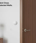 Peel And Stick Silicone Door Stopper No-Drill Self-Adhesive Wall Bumper in use on white wall with wooden door