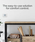 Non Programmable Thermostat With Backlit Display And No Fuss Simple Manual Controls on wall in modern room setting
