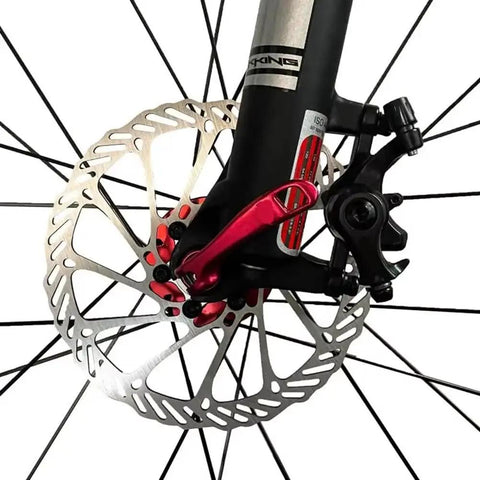 Hardcore Mountain Mechanical Disc Brake Kit With Front And Rear Calipers And Pro Levers Features Rapid Mount Setup And Tight Cable Routing, close-up of front caliper and disc.