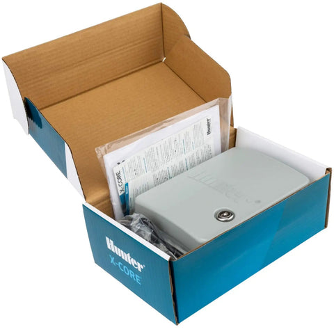 Boxed XC400 4 Zone Outdoor Sprinkler Controller with Weather Resistant Irrigation Timer and manuals for easy install.