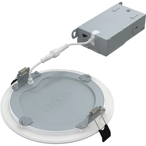 Field Adjustable Edge Lit LED Downlight With Canless Wafer Design, 5CCT 2700K To 5000K, 90 CRI, Wet Rated, Dimmable, Ultra Thin Canless Ceiling Light In Black Or White Trim, Sizes 3 4 6 And 8 Inches, shown from a front angle with connection box.