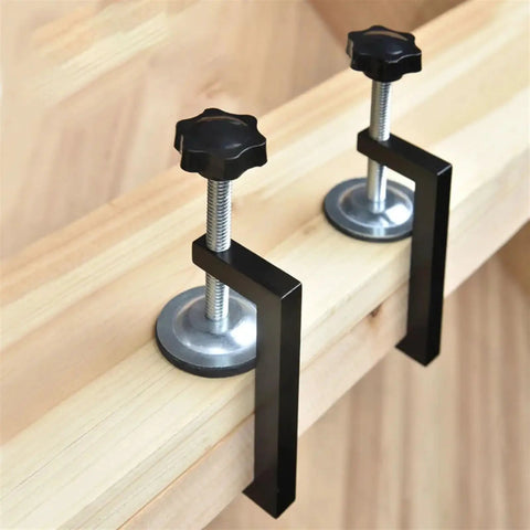 Rock Solid Reversible C Clamp For Woodworking And Plastic Projects 10 To 57mm Wide with adjustable black knobs and metal fixture.