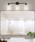 Go To Modern Matte Black Vanity Light Fixtures 24 Inch Three Light Hammered Glass Industrial Sconces above bathroom mirror