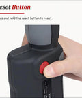 Cordless Hydraulic Cable Cutter With 60 KN Cutting Power, 18V Battery, Slices Copper And Aluminum Cables Up To 30 Mm, ACSR Ready For Pros And Weekend DIYers reset button close-up